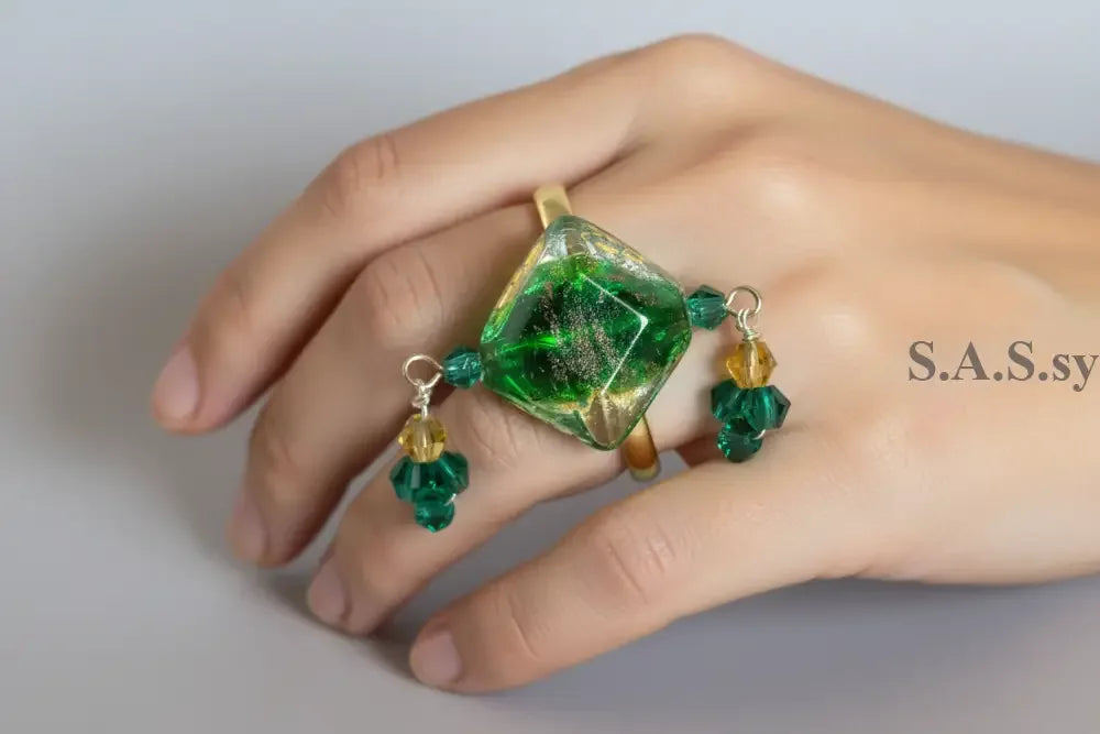Green glass bead Charm Ring on a hand
