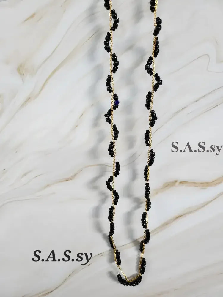 Black Seed Bead Threaded on Golden Chain - Sassy by Sharmin Aziz