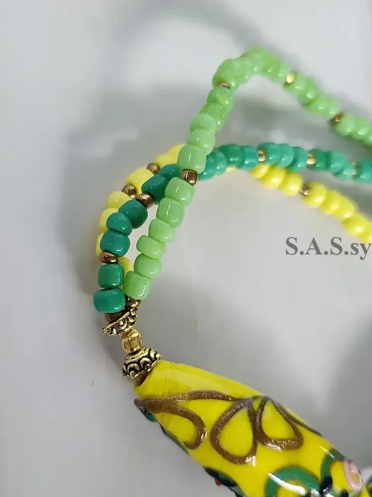 Close up yellow handmade glass bead necklace- Sassy by Sharmin Aziz