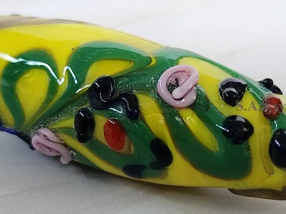 Close up yellow handmade glass bead - Sassy by Sharmin Aziz