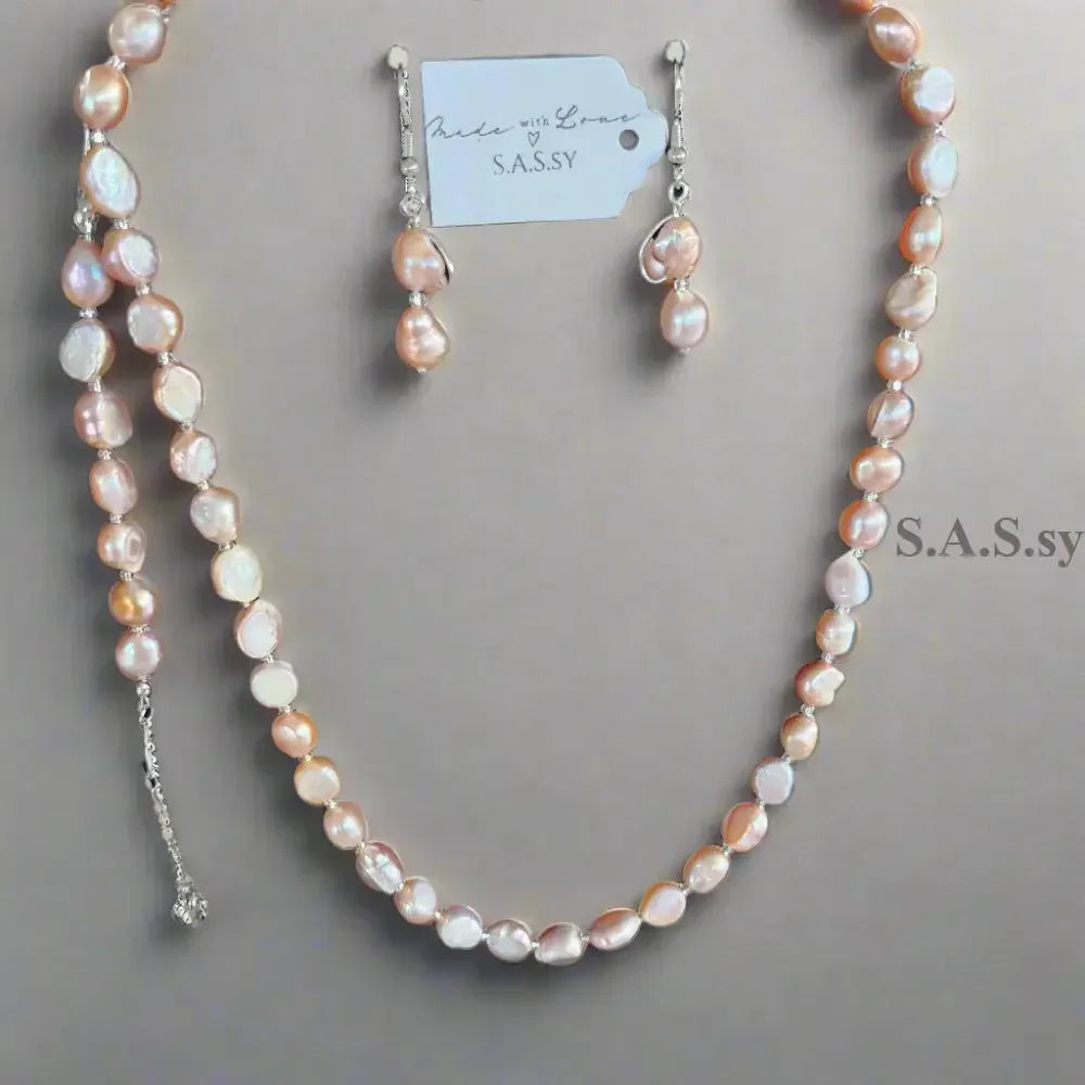 Blush pink Pearl necklace  on a light gray background