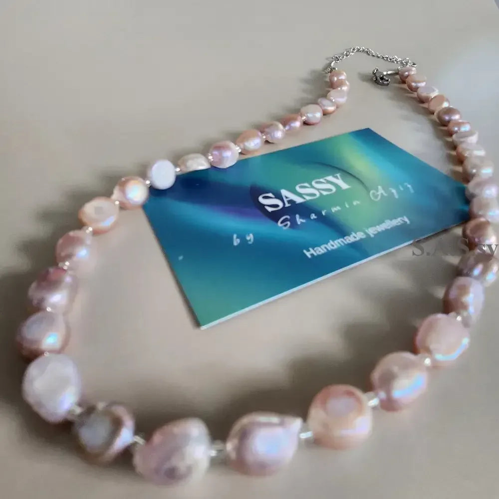 Blush pink Pearl necklace  on a light gray background