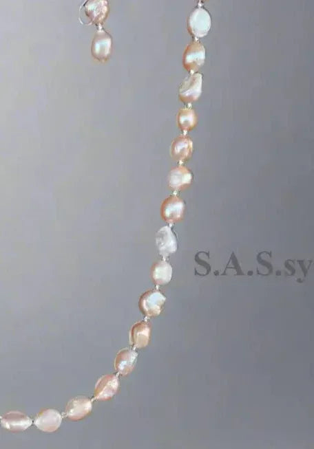 Blush pink Pearl necklace  on a light gray background