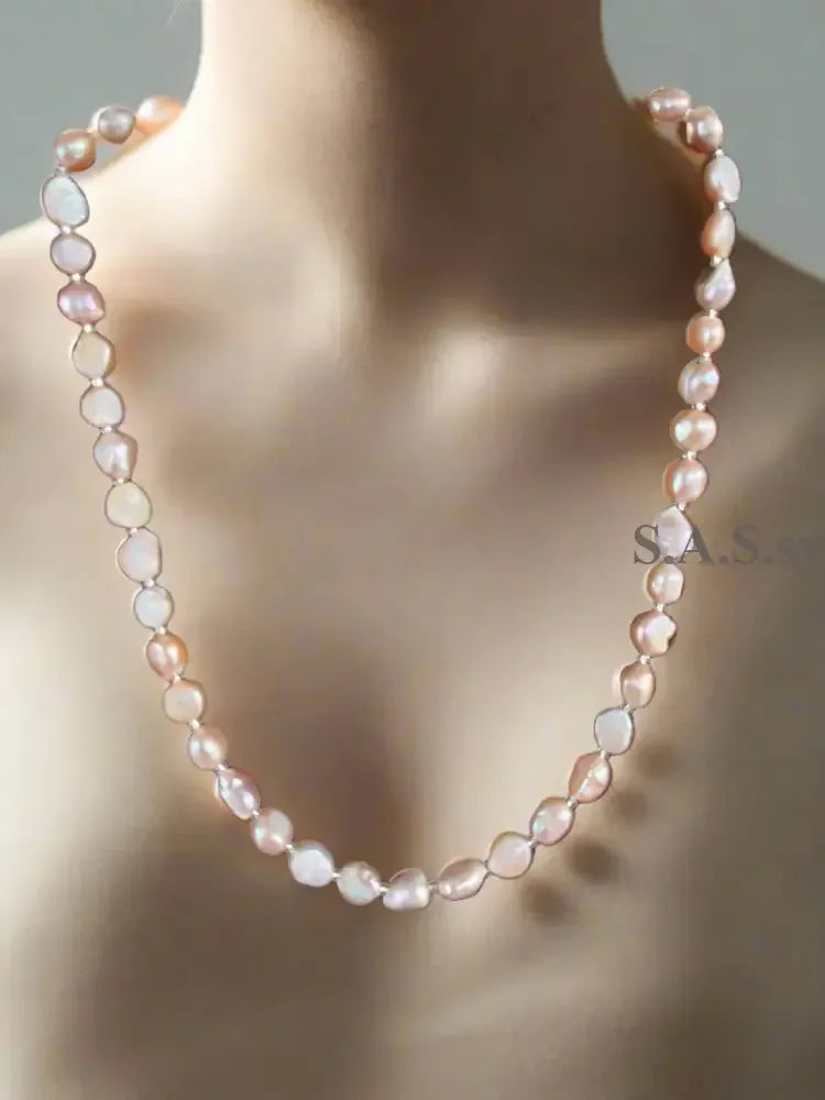 Blush pink Pearl necklace  on a light gray background