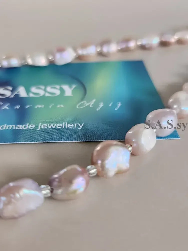 Blush pink Pearl necklace  on a light gray background
