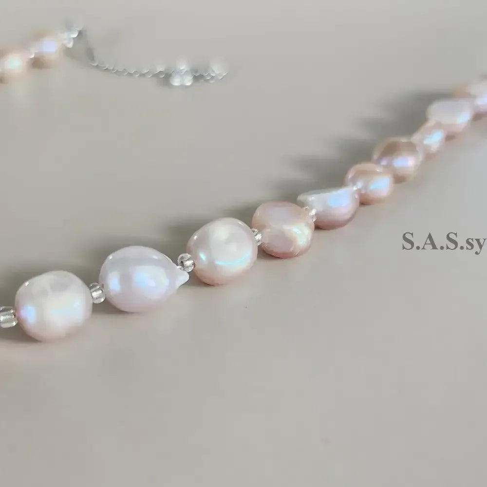 Blush pink Pearl necklace  on a light gray background